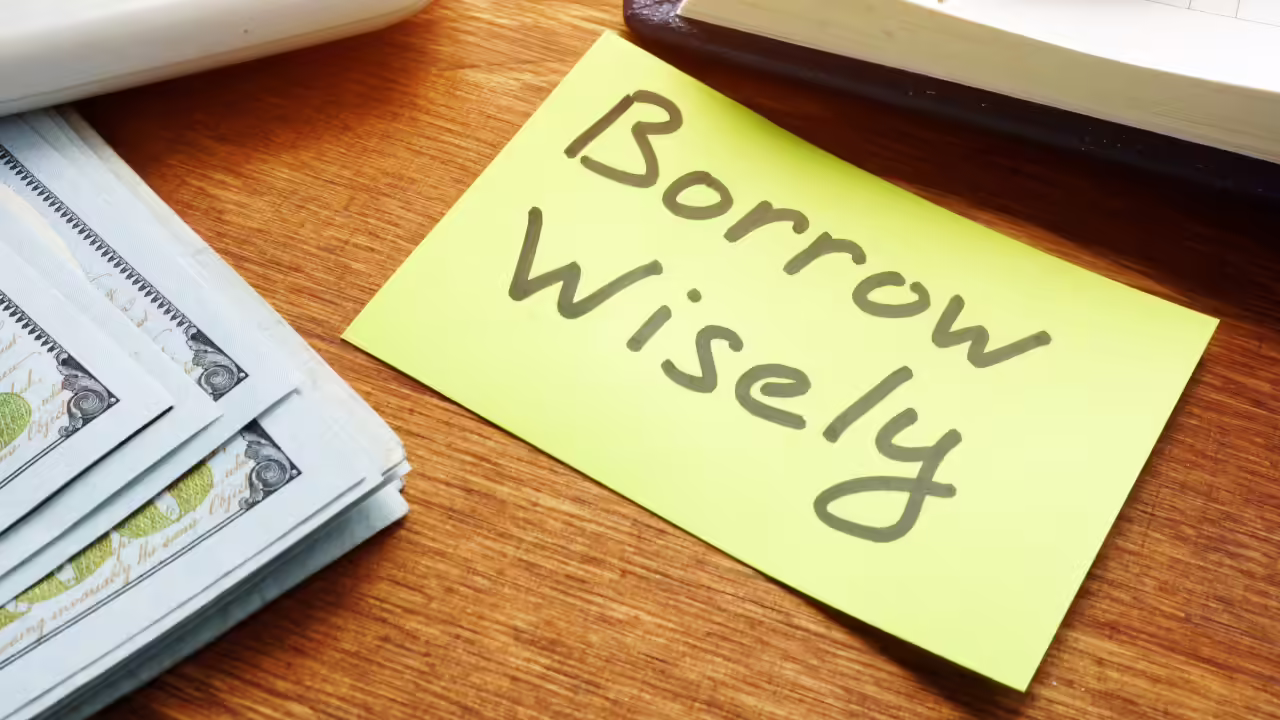 Slip on which Borrow wisely is written