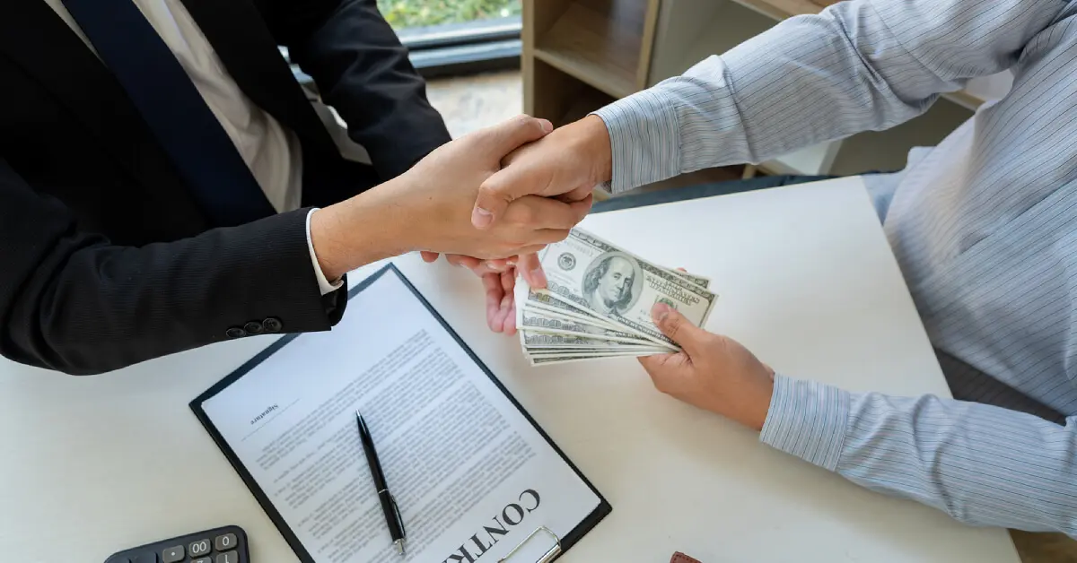 showing deal by shaking hands