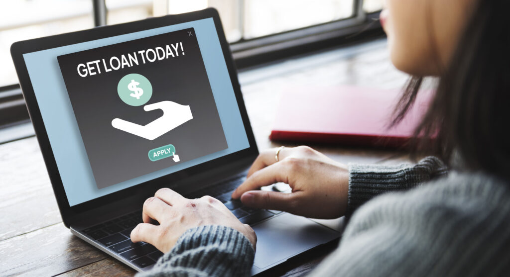 Licensed loan application process, showing a person clicking “Apply” on an online loan application.