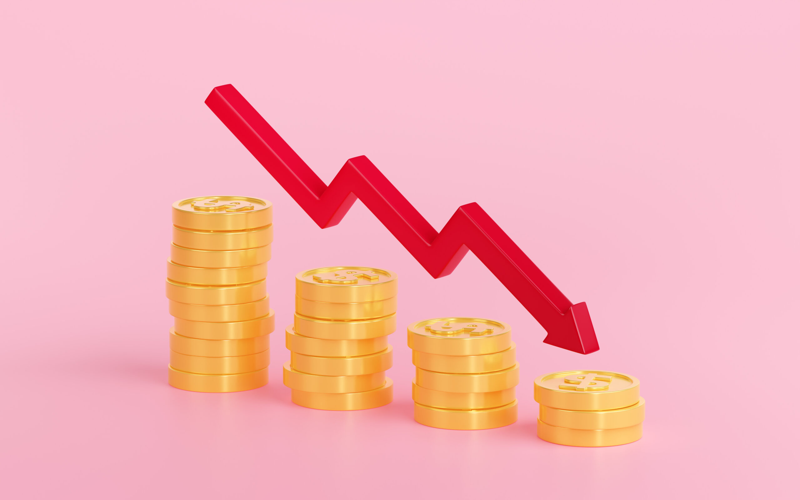 Stacks of coins decreasing under a downward arrow, illustrating seasonal business cash flow changes between busy and slow months.